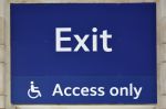 Confusing signage with International Symbol of Access wheelchair sign saying "Access Only", with the word "Exit" above this. Is this an exit or entrance?