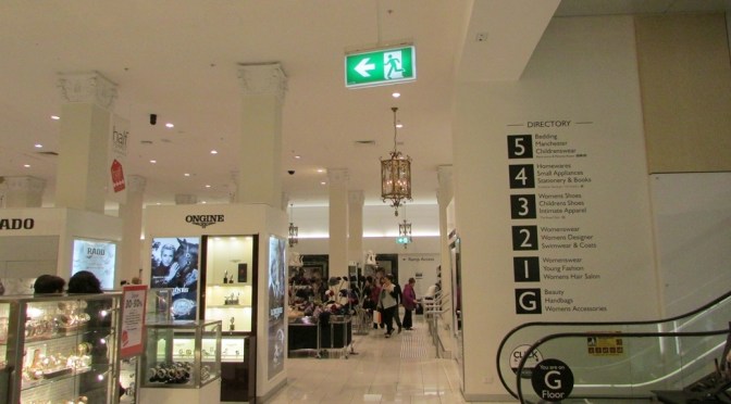 Melbourne Department Store exit sign in front of escalator